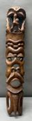A carved wall hanging tribal carving