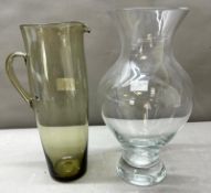 Glassware: A glass jug and a glass vase