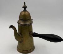 A vintage brass stove top coffee pot