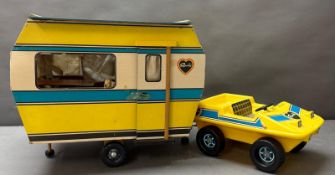A Vintage Sindy car and a wooden caravan