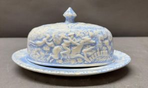A blue and white lidded butter dish