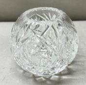 A cut glass ball shaped vase