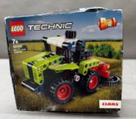 A boxed Lego Technic retired set 42102 Claas Tractor