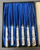 A cased set of six butter knives