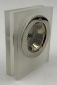 A white metal and frosted resin desk clock