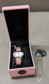 A pink Seksy ladies bracelet watch together with a lady bird watch