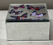 A mirrored jewellery box featuring butterflies
