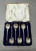 A boxed set of six silverplate scallop coffee spoons