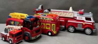 A selection of three toy fire engines and a bus, various makers