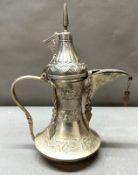 A Middle Eastern white metal Dallah, coffee pot