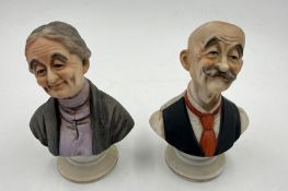 A pair of bisque busts of a man and a woman