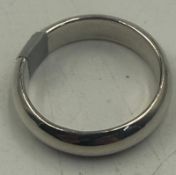 A silver band style ring marked 925