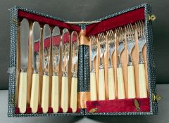 A boxed EPNS set of six fish knives and forks