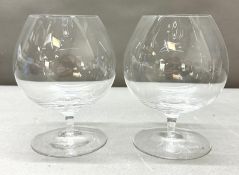 Two Dartington glass brandy balloons.