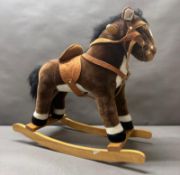 A Plush children's rocking horse by Happy People