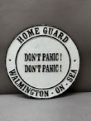 A cast iron Don't Panic wall plaque
