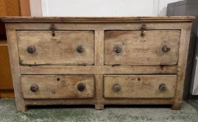 A distressed pine chest comprising of two drop from drawers over two short drawers. Height 78cms
