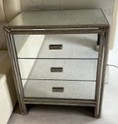 A pair of mirrored bedsides with three drawers H77cm W66cm D43cm