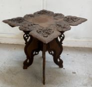 An Anglo Indian carved collapsible tea table H58cm W76cm D76cm
