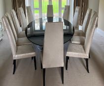Contemporary black glass-topped table with chrome pedestal base and high back fabric chair with
