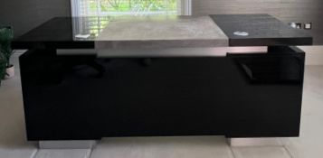 Executive desk with high gloss black finish with a centre section flanked by drawers W272cm D177cm