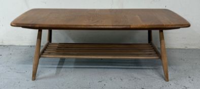 An Ercol plank coffee table with rack under H36cm W104cm D46cm