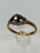 A 9ct gold diamond ring with an approximate weight of 2.1g and size N