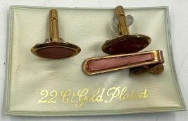 A 22ct gold plated cufflinks and clip set