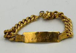 An 18ct yellow gold identity bracelet, engraved, length approximately 19.5cm