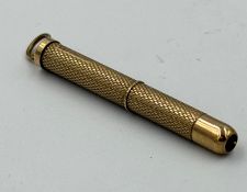 A 9ct gold extendable toothpick, approximate weight 6.6g