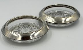 A pair of American Sterling Silver Banded glass coasters by Whiting & Co
