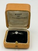 A platinum diamond ring approximate weight 2.1g and size N by Biggs of Maidenhead.
