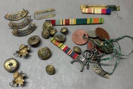 A selection of military badges and buttons