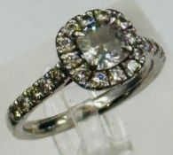 A square cushion Diamond halo ring, platinum set, marked 950, approximate size Q, Clarity FVSI,