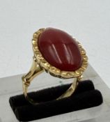An 18ct coral gold ring, approximate weight 8.9g and size L.