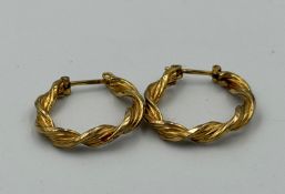 A pair of 9ct gold twisted hoop earrings with an approximate weight of 2g