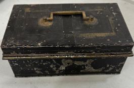 A selection of British coins of various denominations and ages in a metal cash box