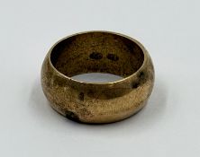 A wedding band marked 18ct and 750 approximate weight 10g