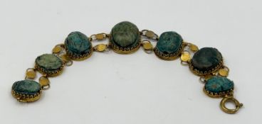 Vintage gold-tone bracelet with turquoise cabochon stones.