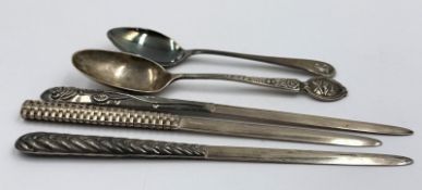 A selection of silver items two silver teaspoons, and three silver marked 925 letter openers,