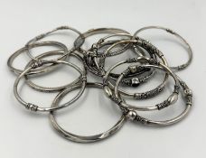 A selection of silver bangles, various hallmarks and designs, approximate combined weight 265g