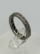 An 18ct gold diamond eternity ring with an approximate size of L and weight of 3.7g