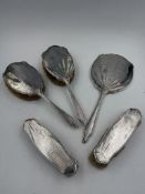 Silver dressing table set comprising a hand mirror, hair brush and clothes brush