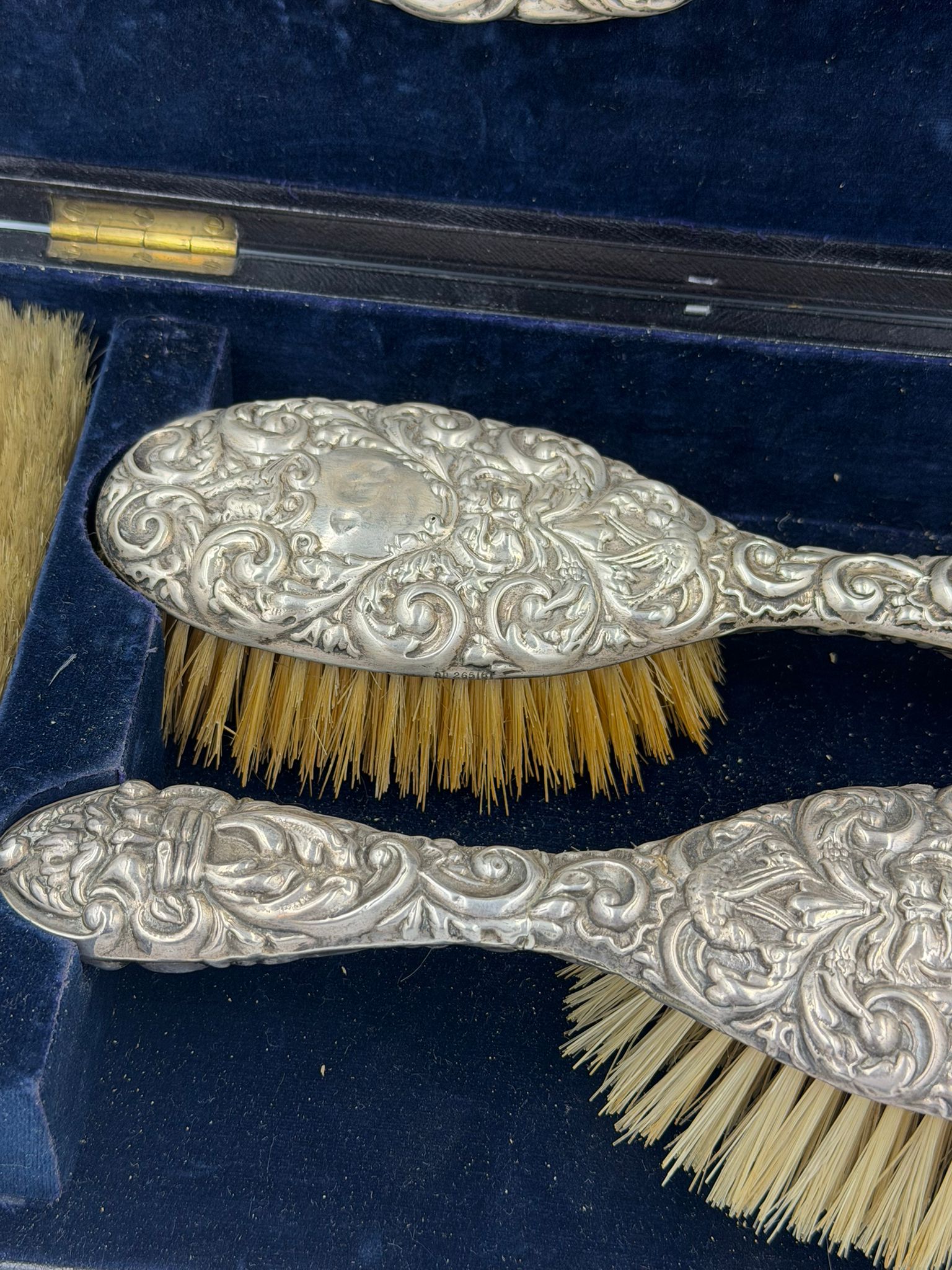 A cased hallmarked silver backed dressing table set with four brushes and a mirror by James Deakin & - Image 2 of 3