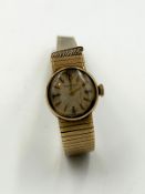 A Ladies Movado 9ct gold watch and bracelet, AF bracelet with an approximate weight of 22.8g