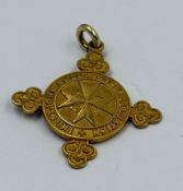 A gold St Johns Ambulance Award engraved to back, approximate weight 5.4, marked 585.