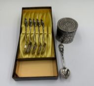 A boxed set of German silver tea spoons together with an embossed cylindrical pot stamped 800