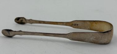 A pair of hallmarked Georgian silver sugar tongs, approximate weight 36g, indistinct marks.