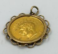 A 21ct gold Pahlavi coin in 9ct gold pendant setting, approximate weight 9.9g