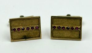 A pair of 18ct gold Gents cuff links with a line of ruby stones on each approximate weight 12g